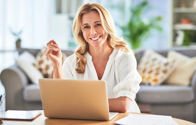Woman at desk with computer.